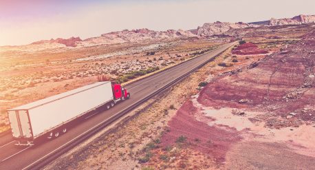 Truck Transport Concept. Semi Truck on the American Desert Highway.