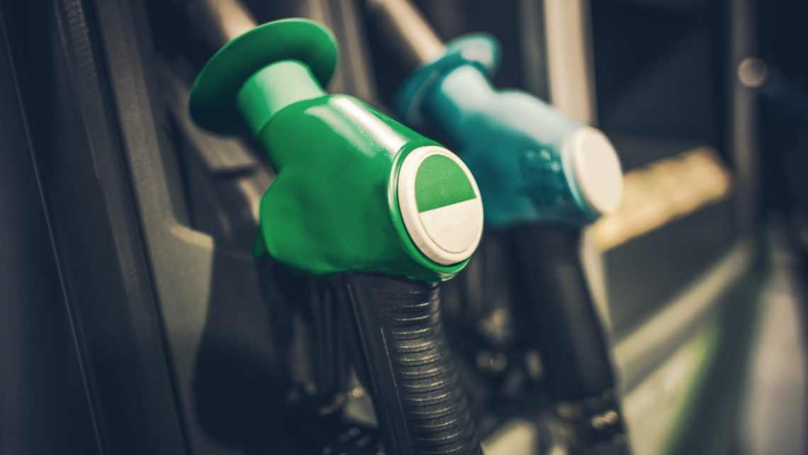 Gasoline Pump Nozzles Closeup Photo. Gas Station Equipment. Car Refuel Concept